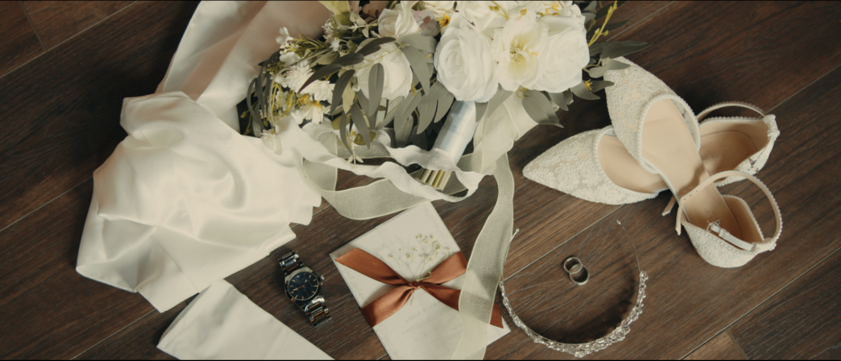 Bridal flat lay with rings and stationery